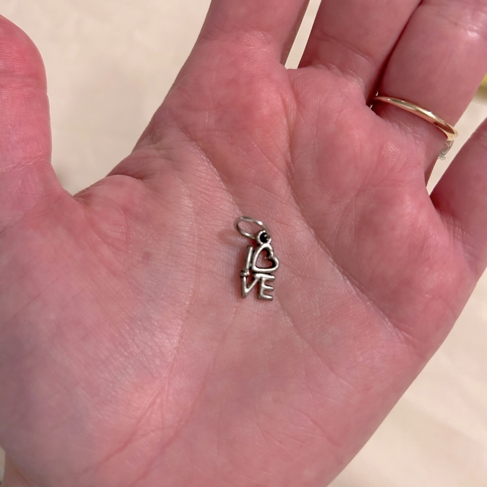 Silver “love” pendant